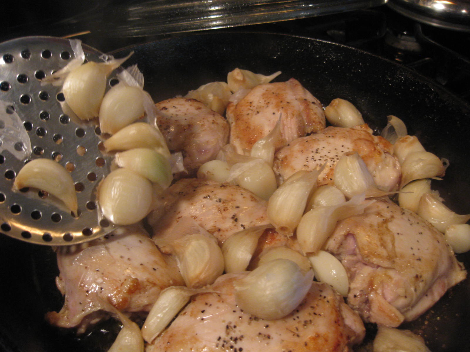 ... blanched garlic cloves to the skillet. Arrange the cloves on top of
