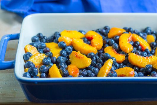 blueberry peach cobbler tip fruit into dish 7-29-16