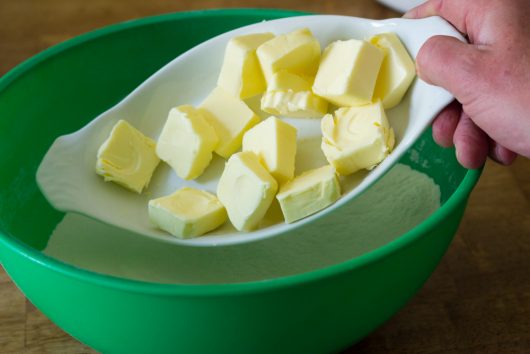 add 12 tablespoons of softened butter