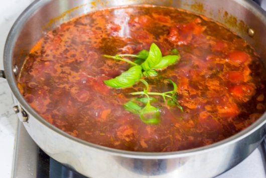 lay the basil on top of the sauce