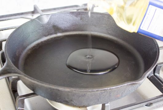 add oil to the cast iron skillet