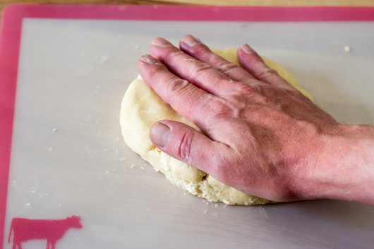 flattening the dough for Rustic Peach Galette