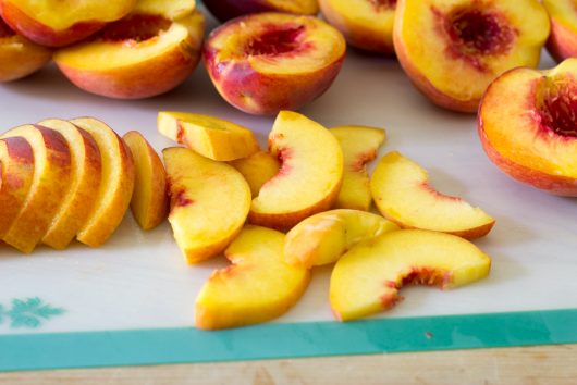 cutting the peaches for Rustic Peach Galette
