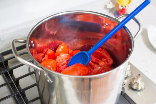 boiling the tomatoes for Homemade Tomato Paste